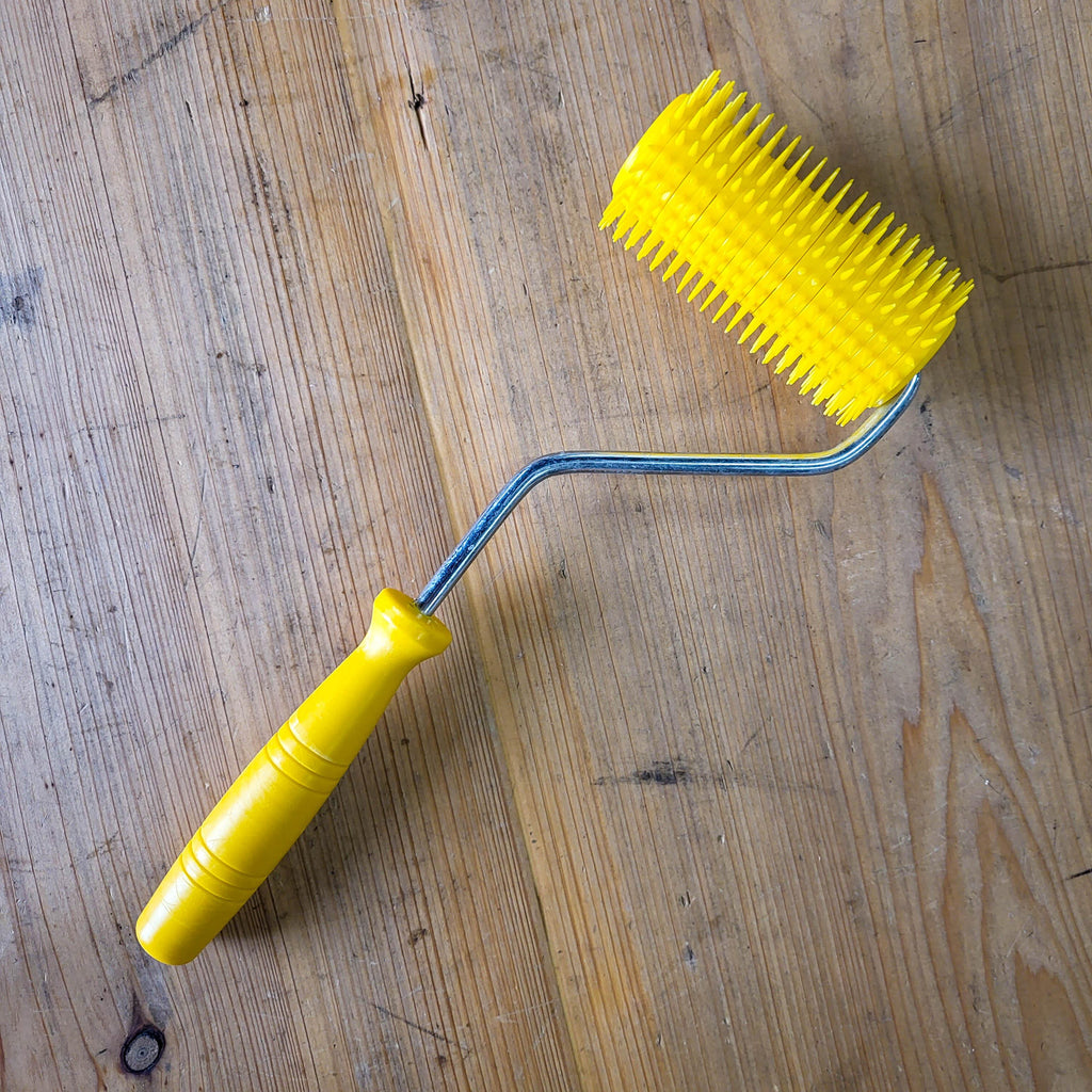 Uncapping Punch Roller